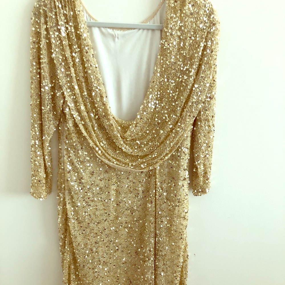 Formal open black, gold sequined dress.